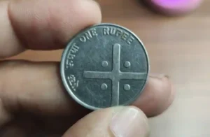 1 Rs cross coin front